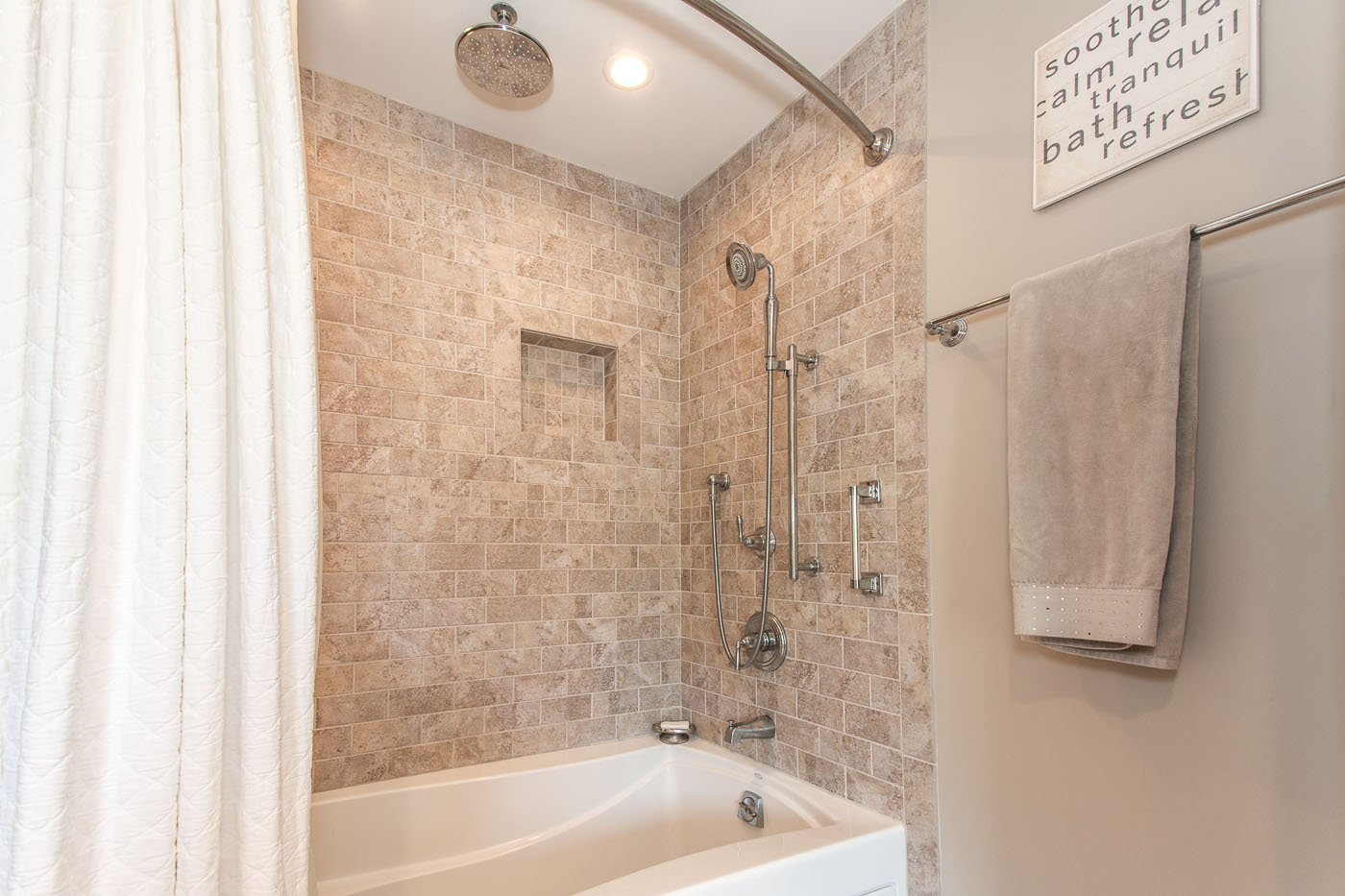 Bath with shower with subway tiling surround